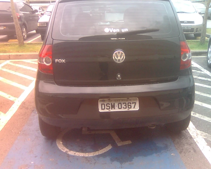 the back view of a car parked in the parking space