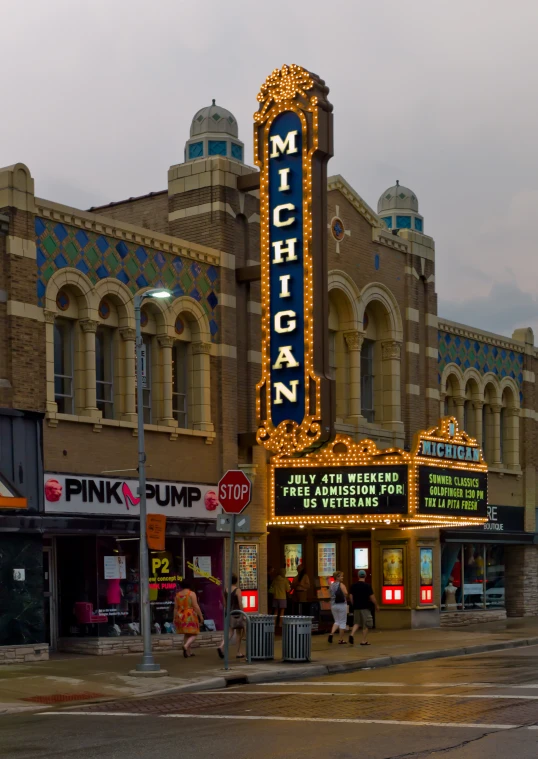 an outdoor theater with many signage lit up