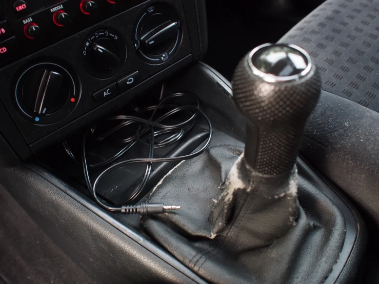 a picture of the  on a car with a radio and two other electronics