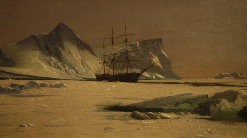 an old ship is docked in the icy water