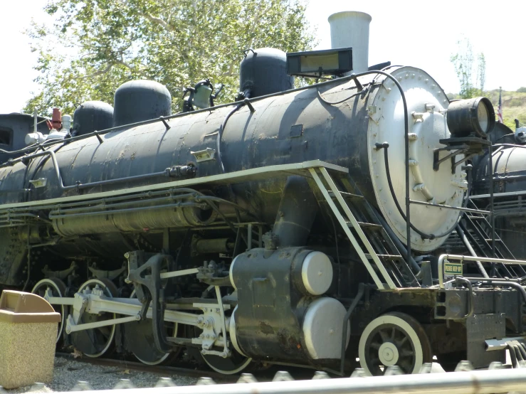 an old train parked in front of a building