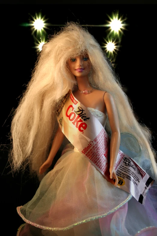 a blonde barbie with white hair wearing a dress