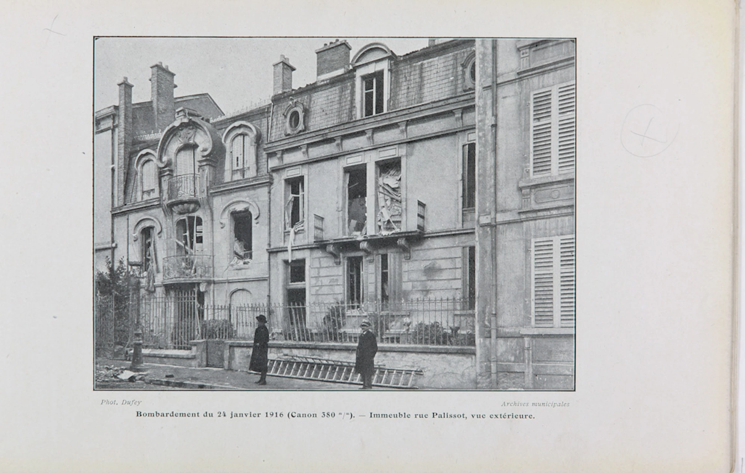 an old pograph of buildings in black and white