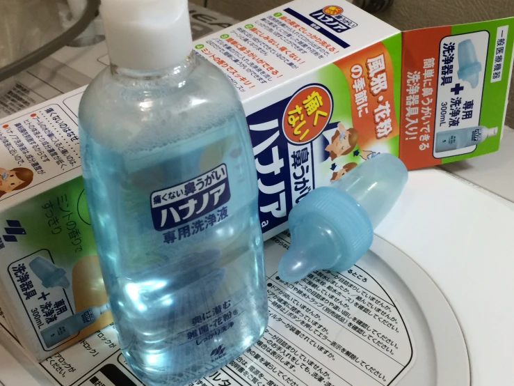 a blue bottle of water on a sink