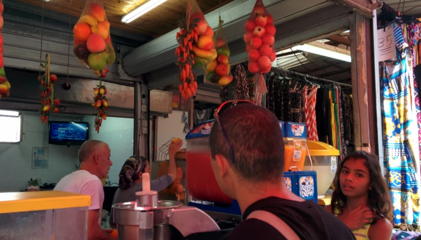 the men are talking in front of the store