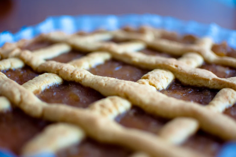 a pie is filled with an intricate cookie like pastry