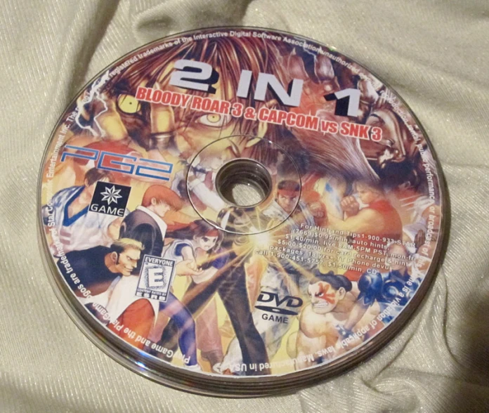 a dvd with the cover pulled down laying on a white cloth
