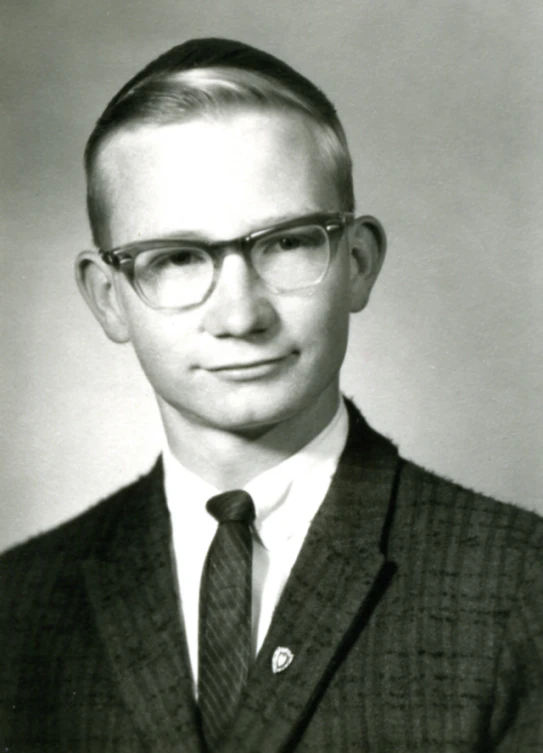 the old po shows the young man in the suit and tie