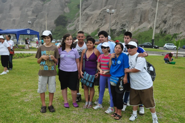 the group of young children is taking a picture together