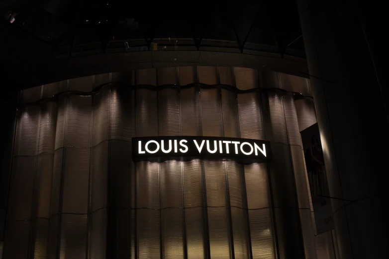 the louis vuitton building sign illuminated by lights