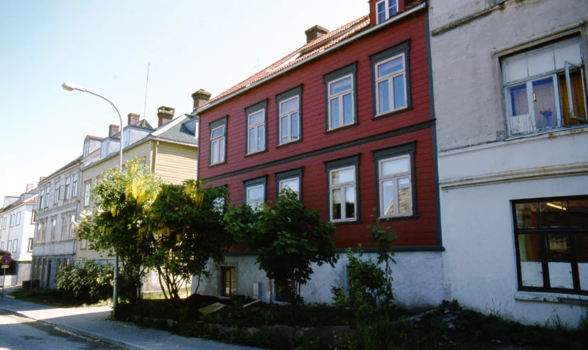 several residential buildings that look like they have been painted red