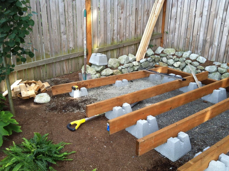 outdoor play area in backyard with gravel and rocks