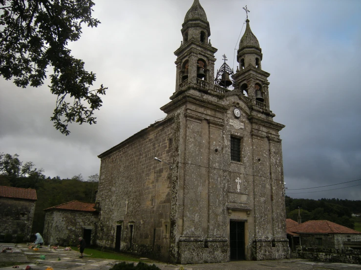 a tall church with a large clock on the front of it