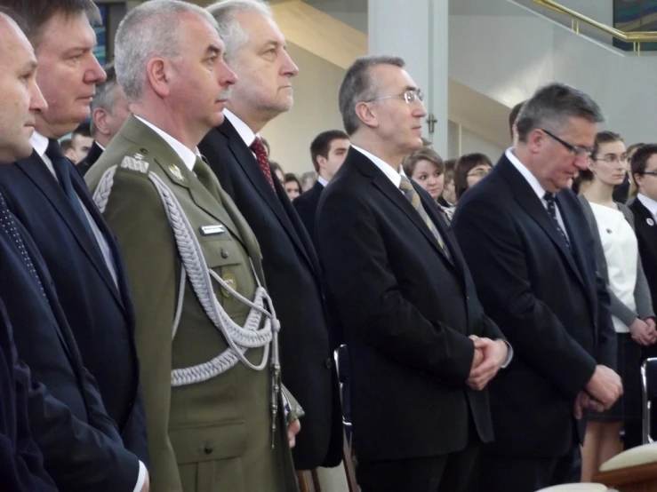 a group of military men standing together next to each other