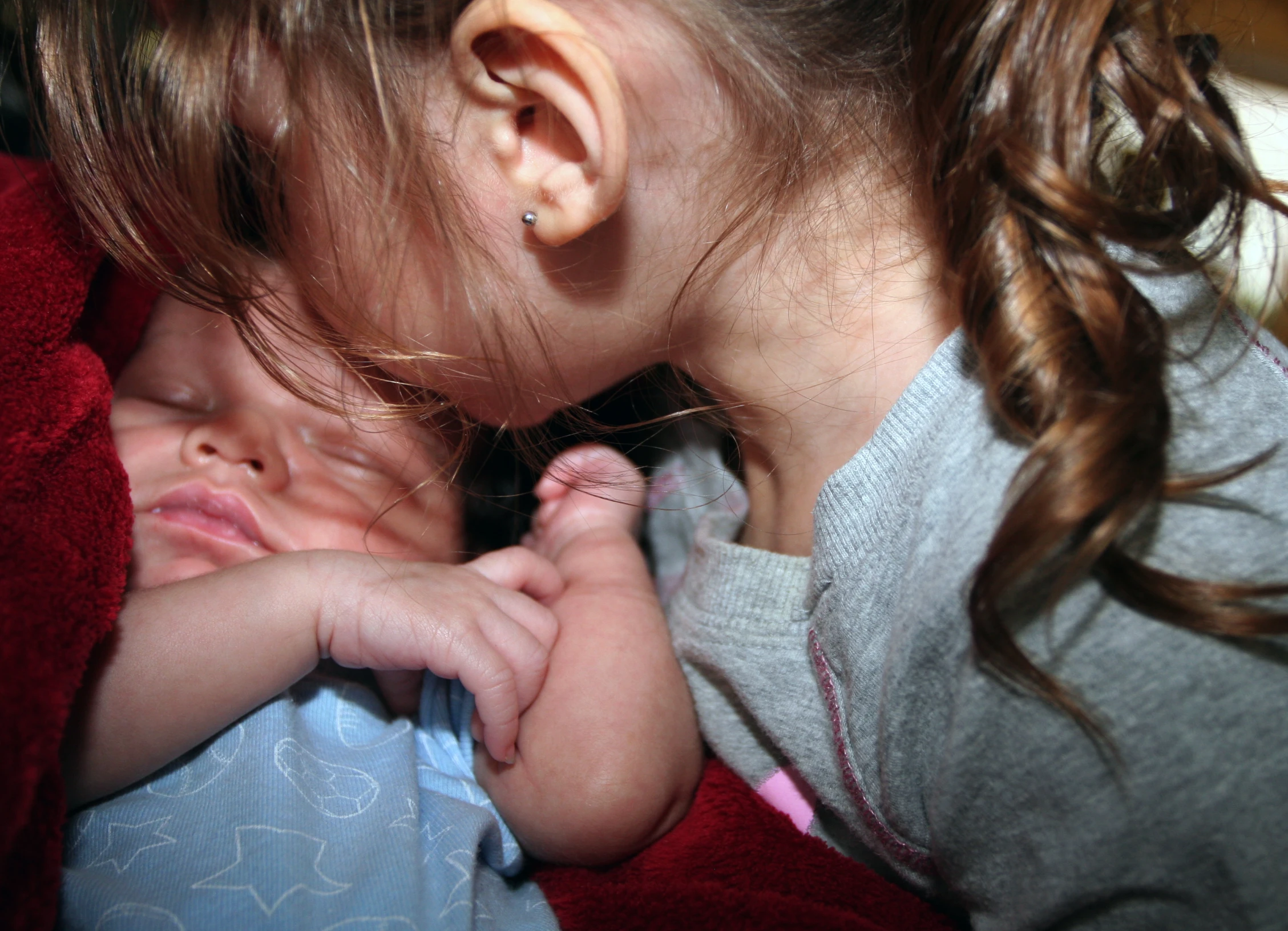 a couple of small children sleeping next to each other