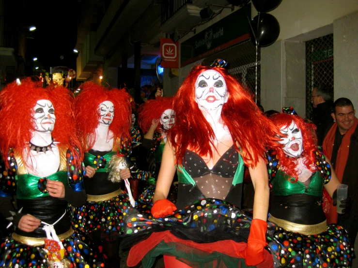 several women dressed as zombies in costumes at an event