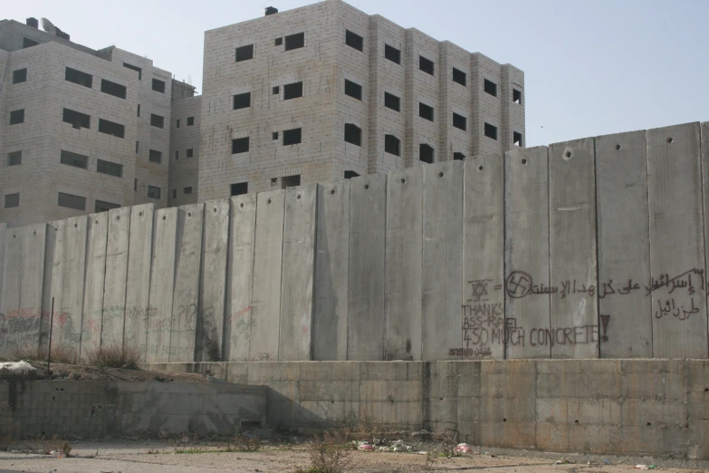 an old building with some graffiti writing on it