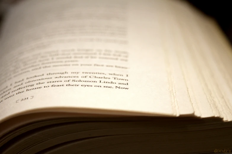 an open book sitting on top of a table