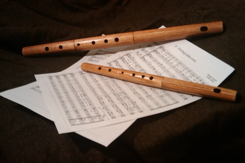 flute, sheet music and musical notation on a table