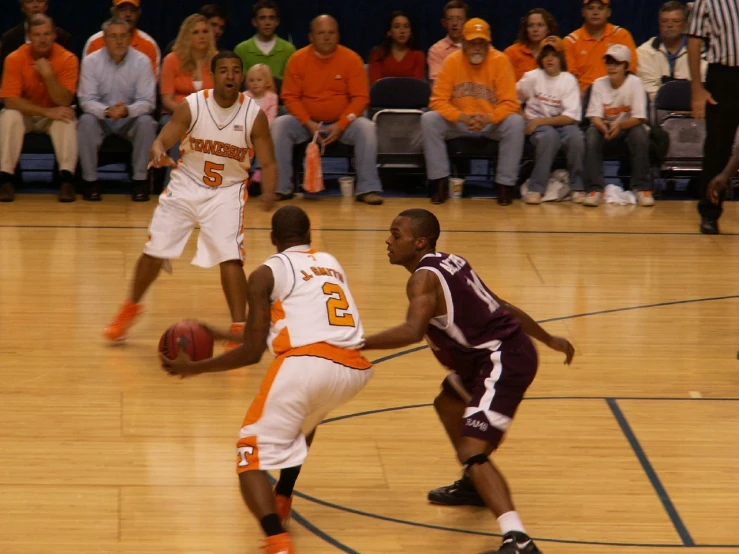 two basketball players on opposing teams during a game