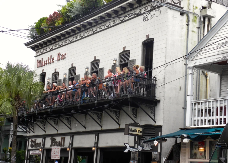 some people are riding their bikes on a balcony