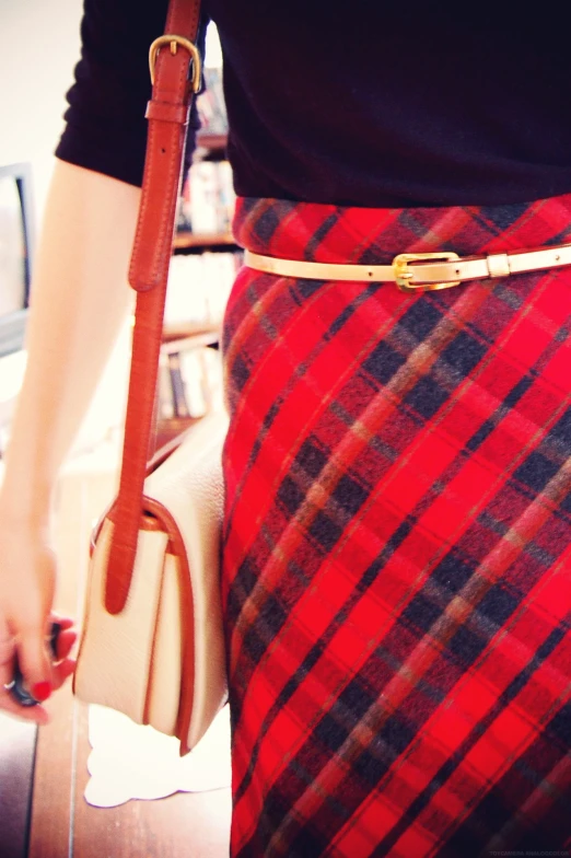 a close up of a woman holding a purse