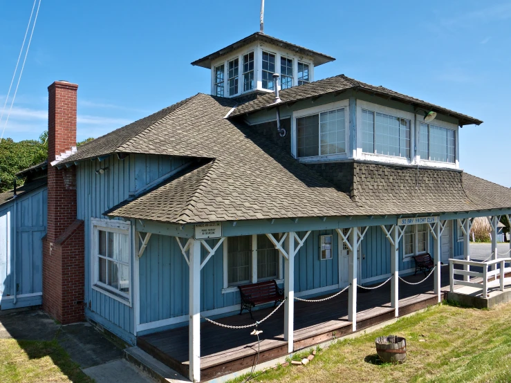 this building is on the corner of a grass area