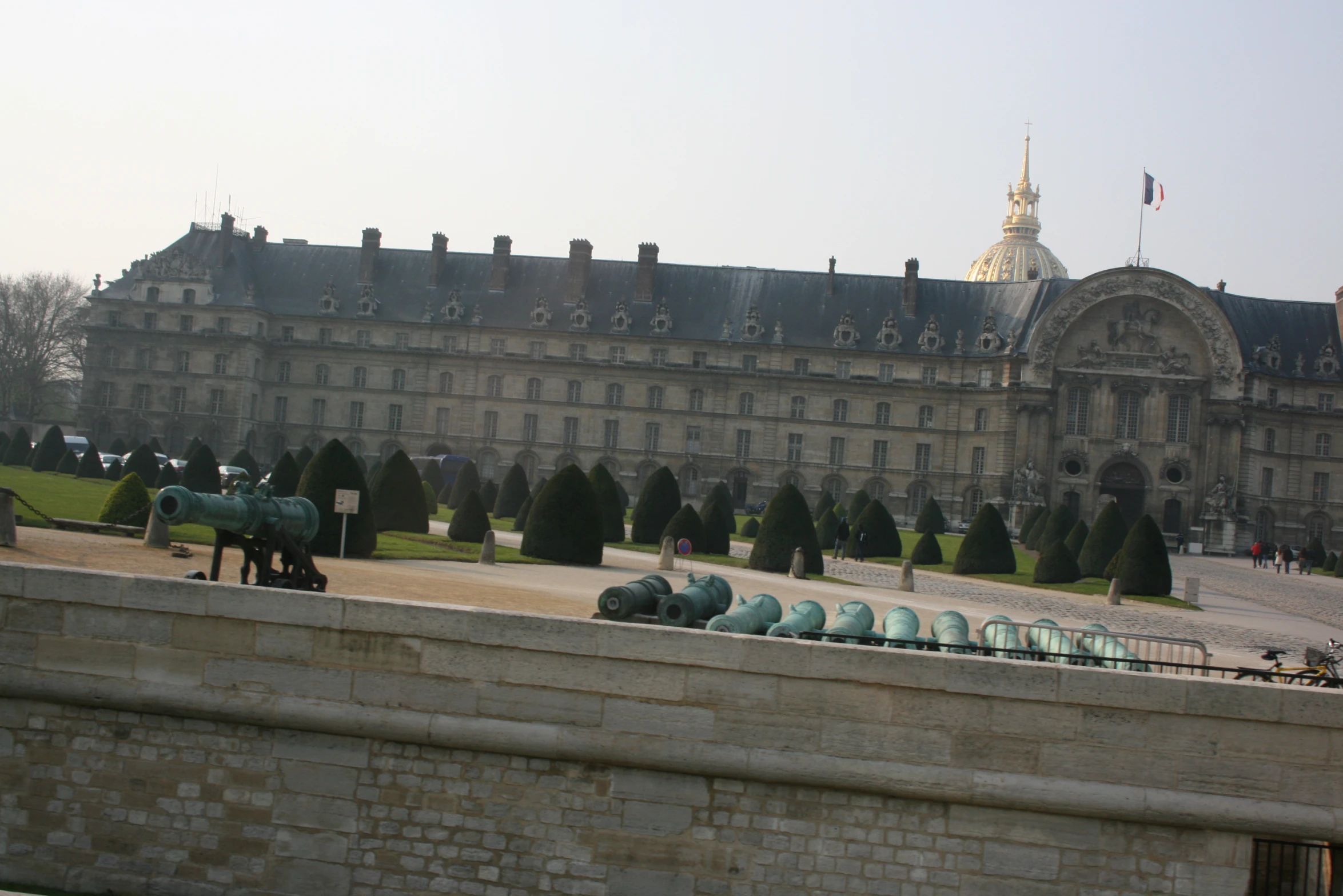 old building with several round blue barrels on top