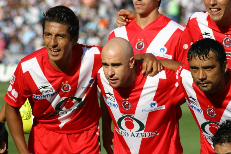 some soccer players on the field in their uniforms