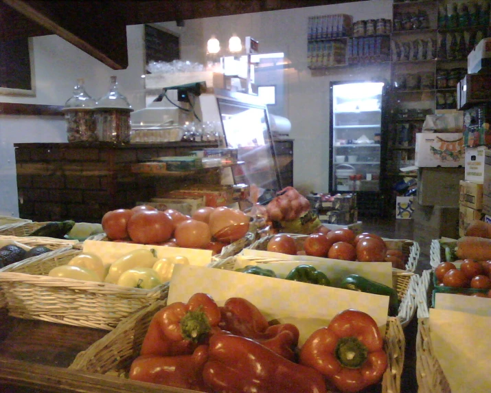 tomatoes and peppers at a farmers market in an old building