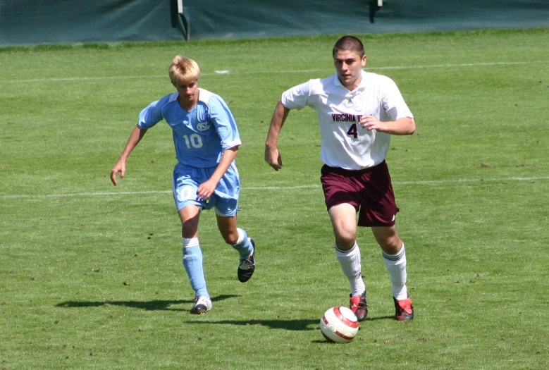two soccer players compete in a game of competitive action