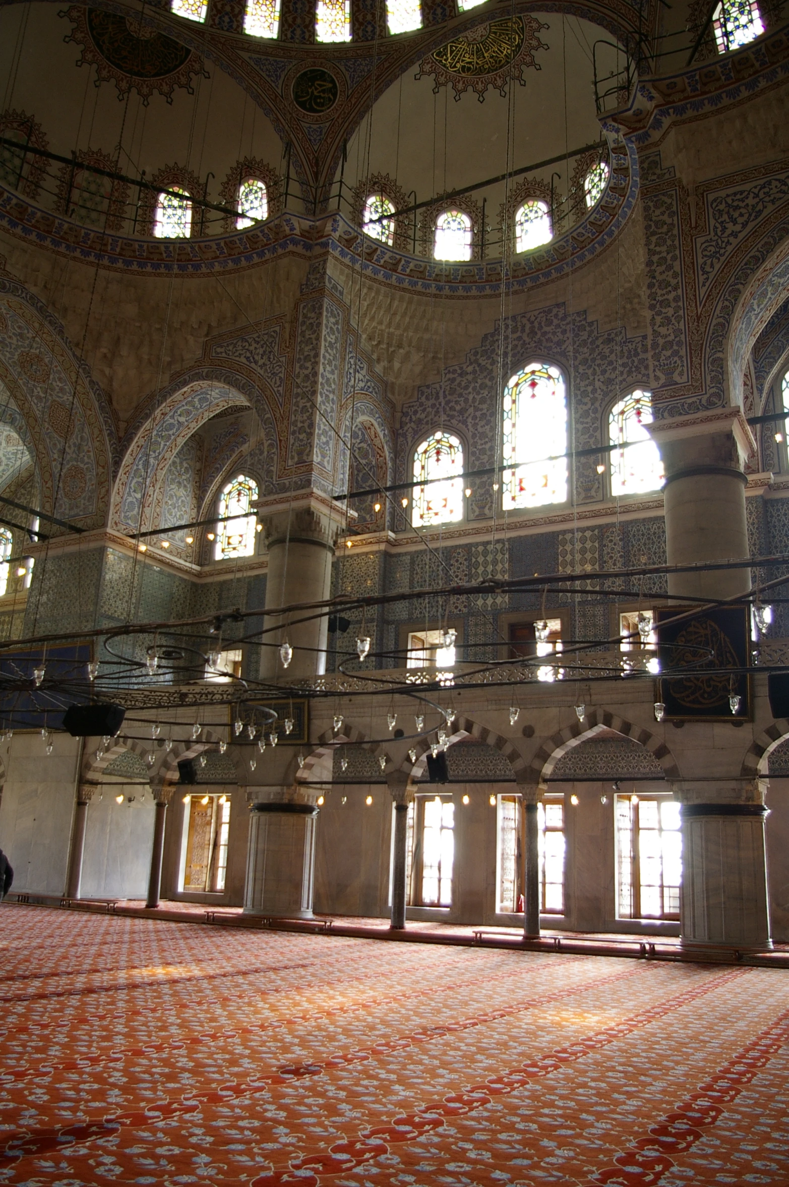 the inside of a large building with windows and ornate decorations