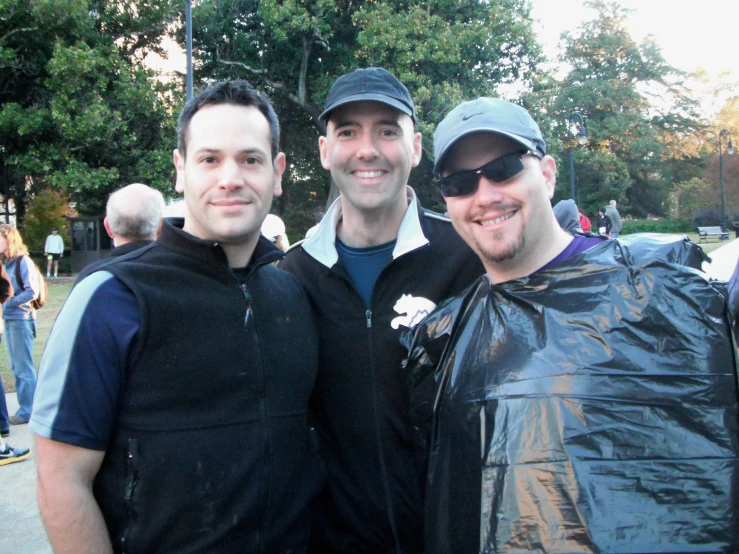 two males wearing black are standing together