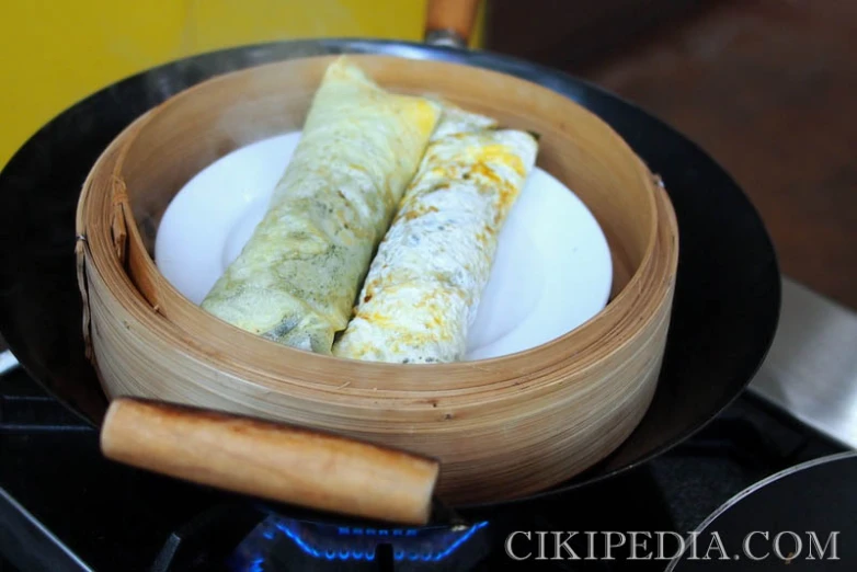 two cooked food items in the middle of a container