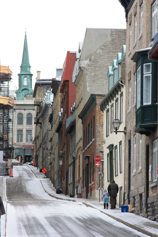 a street with several buildings in winter