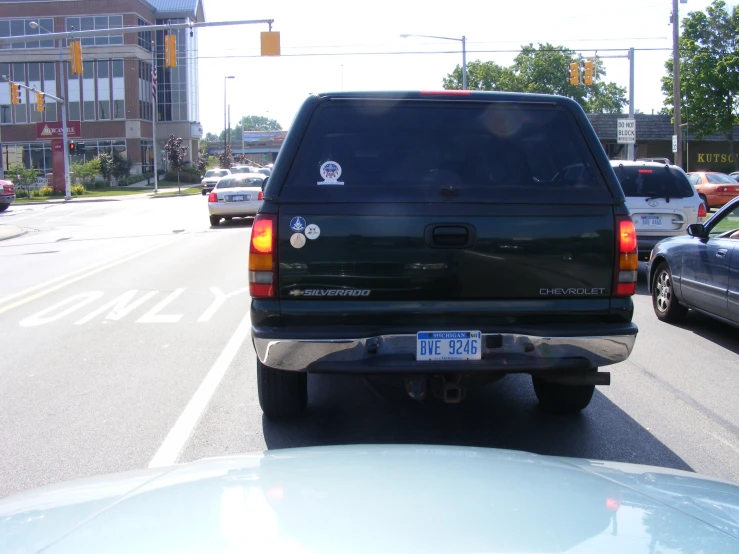 a vehicle parked at a stop light on the street