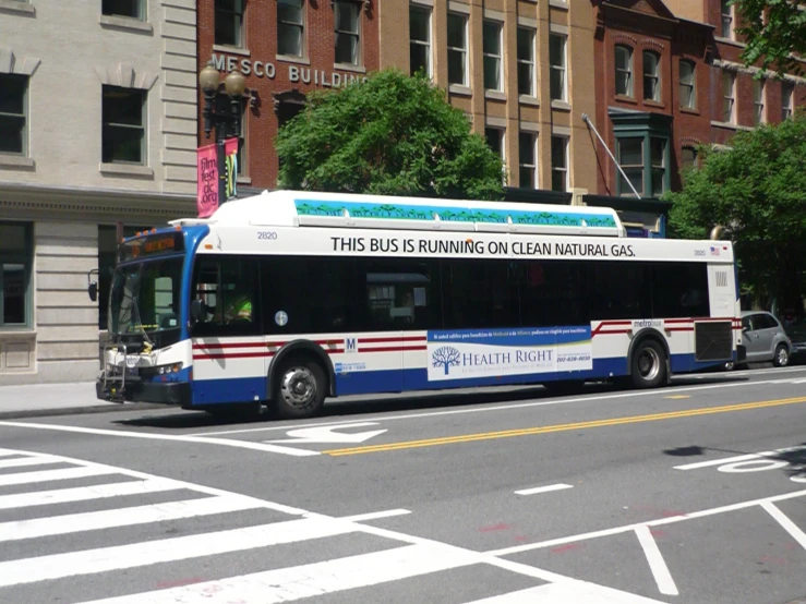 an image of a public bus going down the street