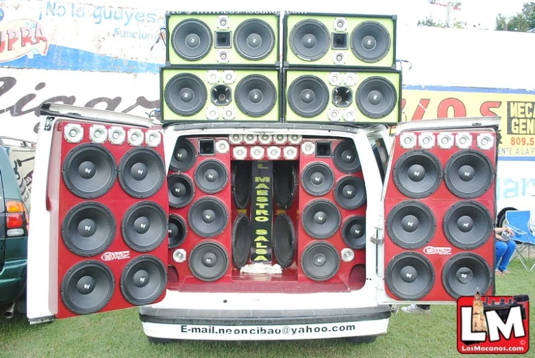 a large speaker truck is loaded with large speakers