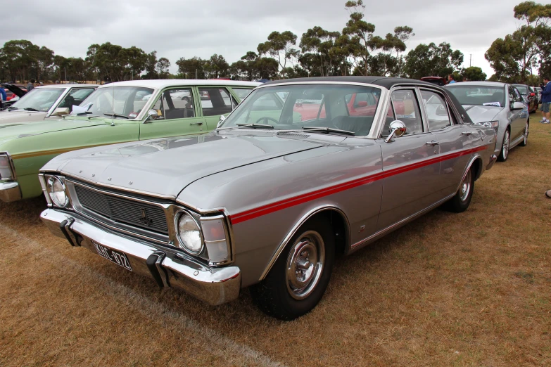 old fashioned cars are parked in a field