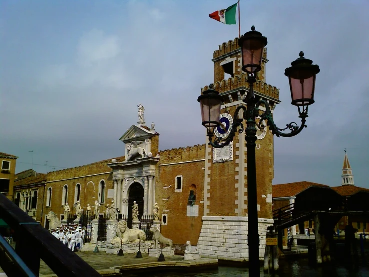 the clock tower is surrounded by lights at the corner