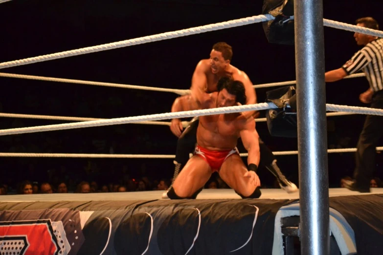 two men wrestle during a wrestling match