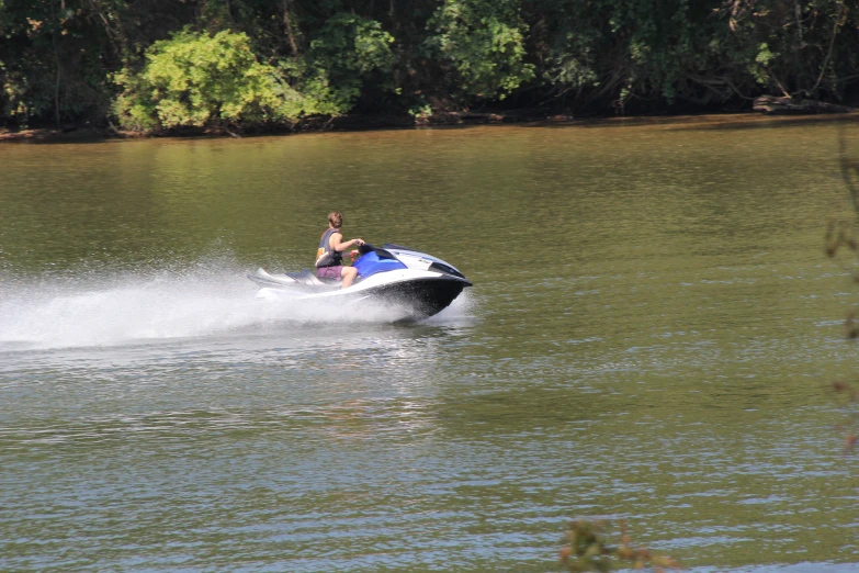 a woman is being pulled on water skis