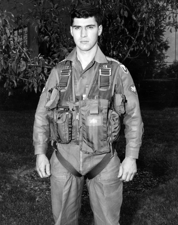 a black and white po of a man wearing military gear