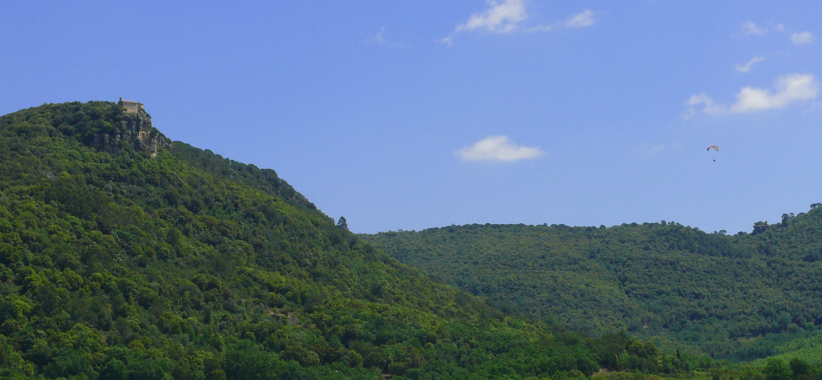 a beautiful view of a mountain and a bird in flight