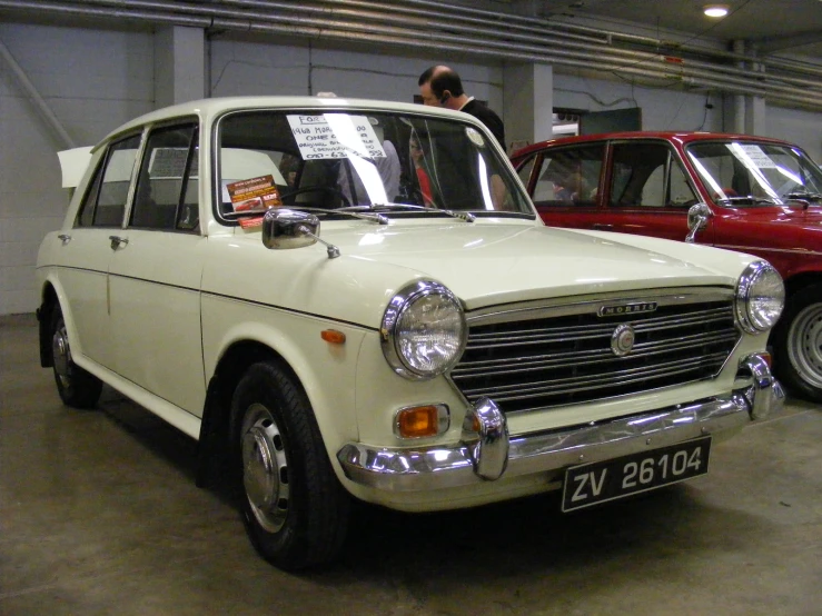 old cars in a parking garage next to each other