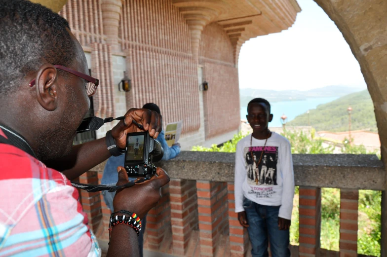 a man takes a pograph of another man taking his picture