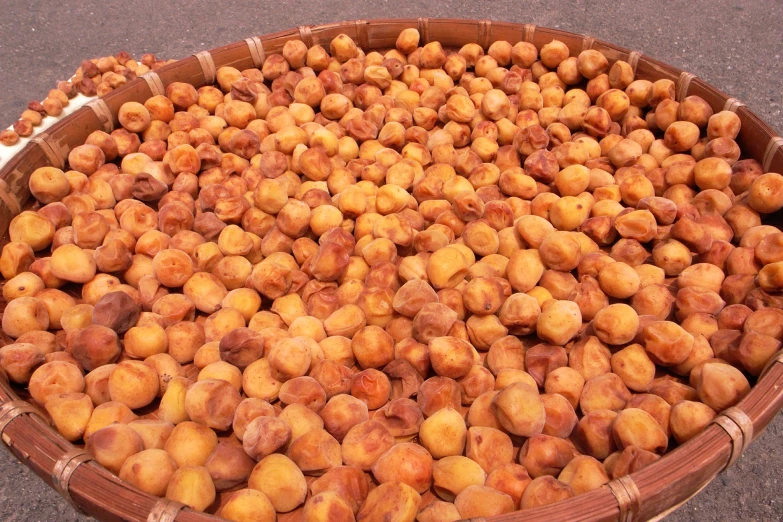 an open basket with fruit in it