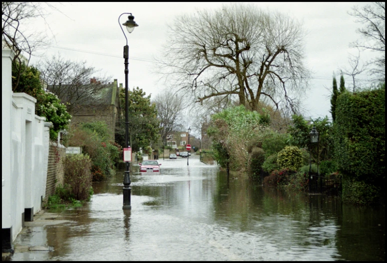 a street flooded with water during the day