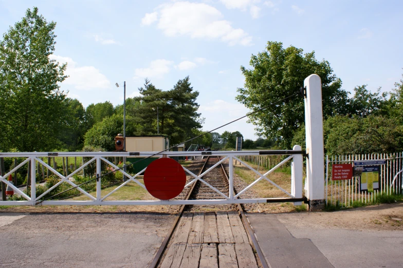 there is a fence that has a large piece of equipment on it