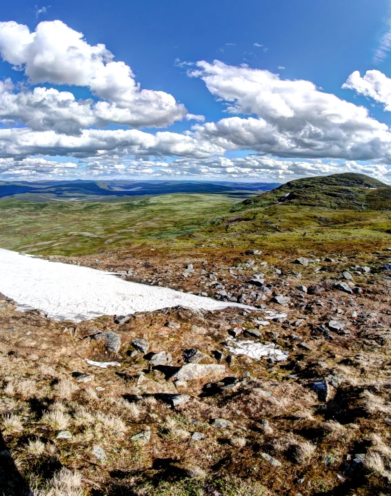 the white trail going to the top of the hill